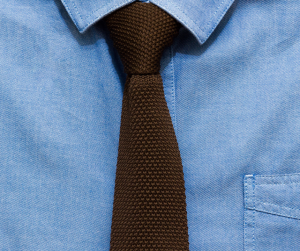 Denim chambray collared shirt with knit brown tie