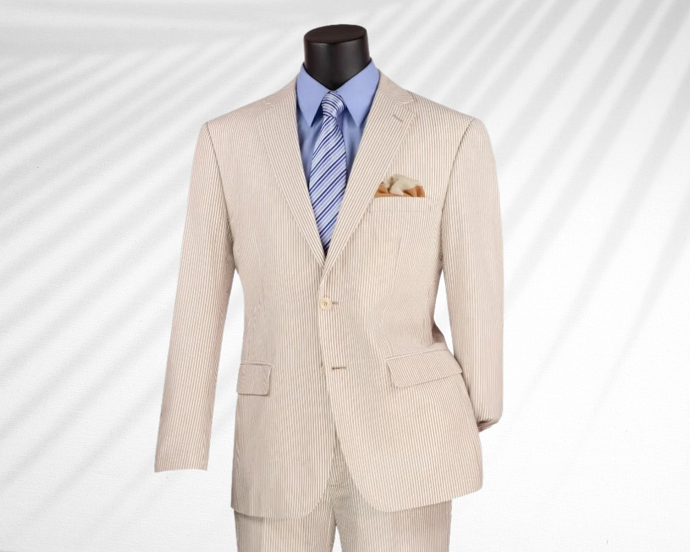 Tan seersucker suit with blue shirt and striped blue tie