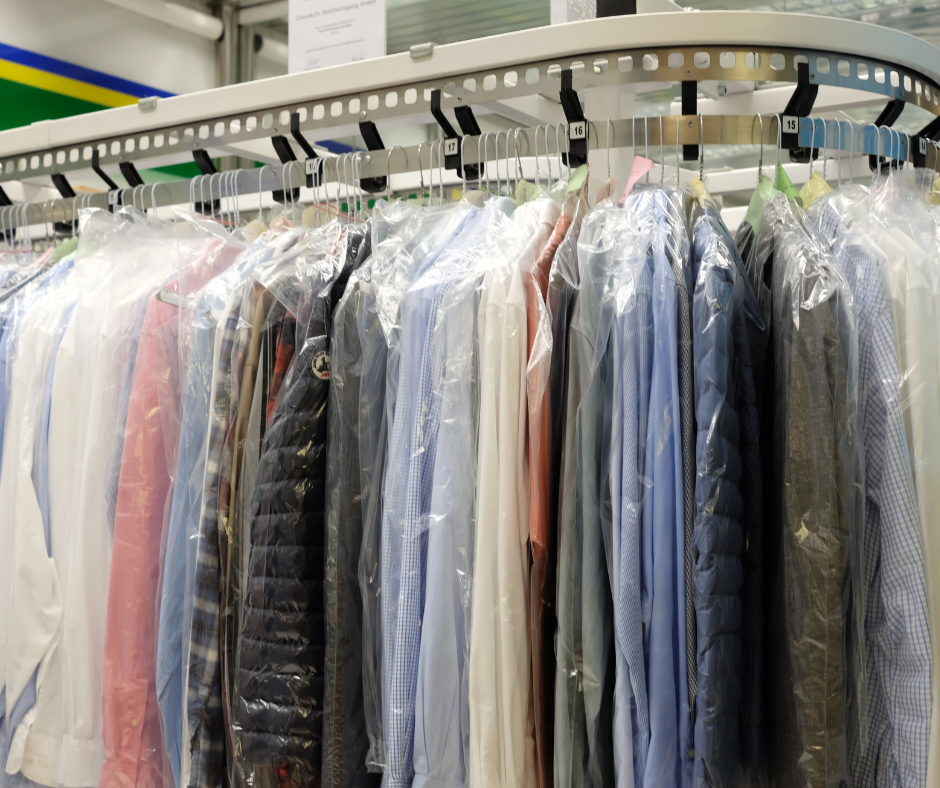 dry cleaning rack of suits