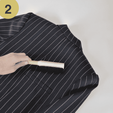 Use a suit brush