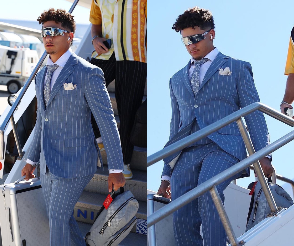 Patrick Mahomes stepping off plane wearing blue suit with white pinstripes — NFL Fashion